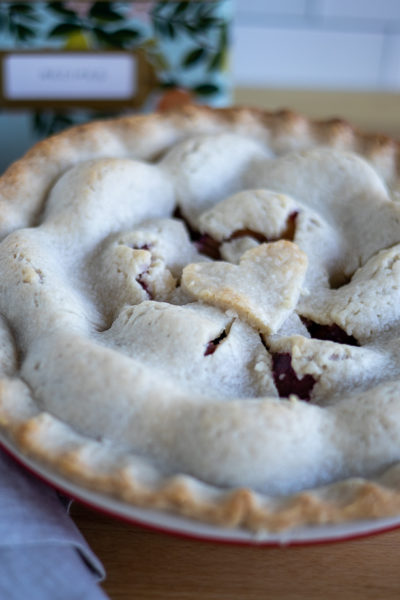 a plum pie sitting on a counter