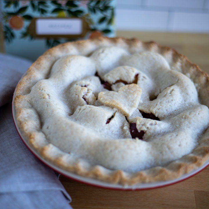a plum pie sitting on a counter