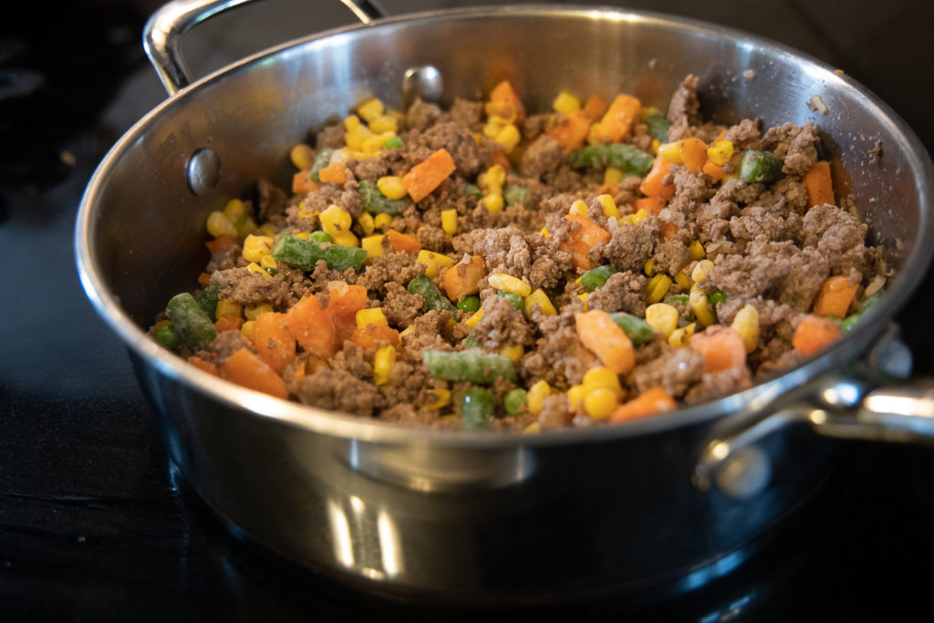 the shepherd's pie mixture with mixed vegetables added