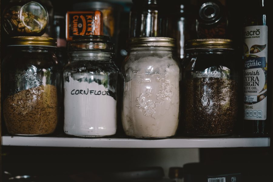 food stored in glass jars on shelves